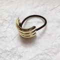Macro shot of gold layered curved metal cuff hair tie with high elastic black rope - Triple Ring Hair Tie (3.1*4cm) / Gold
