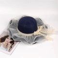 Detail of navy straw hat with beige organza ruffle brim and delicate lace bow accent - M (56-58cm) / Navy Blue