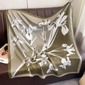 Macro detail of olive green silk scarf featuring delicate white iris floral patterns - 90cmx90cm / Olive Green