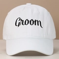 Close-up of white washed cotton baseball cap featuring black Groom cursive embroidery - Groom / White