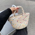 Beige woven bucket bag with colorful pom-poms for a trendy summer vacation style - Beige With Colorful Pompoms