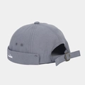 Close-up of grey docker hat featuring white whale embroidery and adjustable metal buckle - Fog Blue