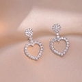 Sparkling silver heart drop earrings with micro-pave cubic zirconia on silk background - Hollow Heart Style (E0045)