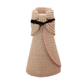 Folded straw sun visor with pink trim and bow showing portable rollup design - Water Pink