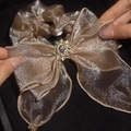 Elegant champagne gold silk hair scrunchie with large bow and rhinestone center - Pearly Champagne