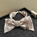 Champagne satin bow headband with sparkling rhinestones and star-shaped crystal accents - Large Khaki