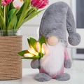 Detail view of a lighted tulip gnome plush doll for home decoration with warm LED petals - Gray