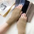 Knitted fingerless gloves in camel brown with ribbed texture for winter warmth - One Size / Camel