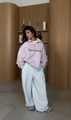 Detail of light pink sweatshirt with 'Peace to the world' embroidery and grey wide-leg pants - S / Pink