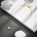 Gold heart necklace with white shell inlay and zircon accents on minimalist stone base - Necklace (F306)