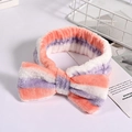 Detail of pink and purple striped coral fleece headband with large bow for face washing - Pink Green and White Stripes