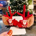 Christmas hair clips featuring red reindeer antlers and Santa Claus with fur pompom details - A14# Santa Claus Style