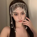 Elegant silver crystal forehead chain with cascading tassels and pearl drops on model - 240302 Silver Waterfall Tassel Headpiece