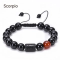 Detailed view of Scorpio adjustable bracelet with black agate beads and engraved scorpion charm - Scorpio