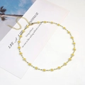 Chic gold-toned necklace featuring white and yellow daisy flowers with adjustable clasp - Little Flower Necklace / White