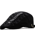 Black cotton newsboy cap with quilted pattern and metal M badge in side view - M (56-58cm) / Black