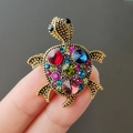 Exquisite turtle brooch with colorful rhinestones on a vintage gold-tone metal base - Colorful