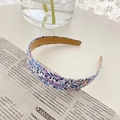 French style purple floral print fabric headband placed on a vintage newspaper background - Blue Floral