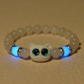 Glow-in-the-dark cat owl charm bracelet with blue luminous beads on leather background - White Jade (White)