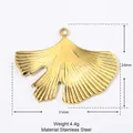 Detailed view of golden ginkgo leaf stainless steel pendant with 31mm x 24mm measurements - YE209/Ginkgo Leaf