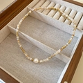 Detail of freshwater pearl and shell pendant on a gold necklace in a wooden jewelry box - Necklace-Gold-Khaki (Gold Plated)