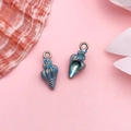 Conch shaped enamel pendants in blue and bronze finish on pink background - Drip Oil Blue Ocean Conch (1PC)