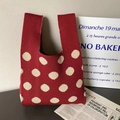 Knit tote bag with red and cream polka dots in a minimalist casual lifestyle setting - Wine Red Beige Dot