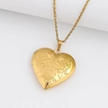 Golden heart locket necklace with embossed floral patterns on a polished gold chain - Patterned Heart/Gold