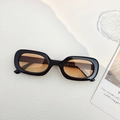 Vintage oval sunglasses with a classic black frame and amber lenses for outdoor style - Black Orange
