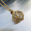 Golden chain necklace with transparent glitter dice pendant in a geometric cage - Gold Cage with Grey Dice