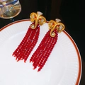 Detail of vintage gold elephant stud earrings with hanging red beaded tassels - Silver Earring Post - Elephant Head Red Bead Tassel Studs (13#)