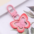 Detailed macro view of pink butterfly acrylic keychain with white star patterns - Deep Pink Butterfly