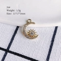 Macro detail of gold-plated moon and star charm pendant with clear crystal inlay - 26# (Sun & Moon)