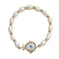 Detailed macro view of baroque pearl bracelet with fish charm and evil eye inlay - Fish Evil Eye Pendant