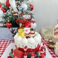 Close-up of Merry Christmas acrylic cake topper with Santa and Snowman figurines - Snowflake Double Layer Red White Merry Christmas