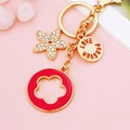 Golden flower keychain with red enamel ring, sparkling rhinestones and Love Forever tag - Rose Red Five-leaf Clover