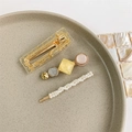 Detailed set of 3 gold hair clips with pearls and resin stones on beige ceramic - Style 13 (3-Piece Set/Yellow-Pink Gold Foil)