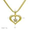Detail of gold heart pendant with turtle design including dimensions 30mm by 36mm - Turtle Pendant