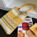 Close-up of yellow knit tote bag with ethnic diamond patterns and striped textures - Geometric Diamond Yellow