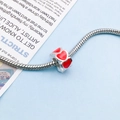 Silver snake chain bracelet featuring a vibrant red enamel heart charm pendant - Red