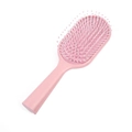 Pink macaron cushion hairbrush with anti-static bristles for scalp massage on white background - Light Pink