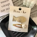 Golden sequin fish and white rose flower hair clip set on a decorative white card - Big Fish + Flower
