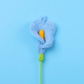 Detail of a handmade crochet blue Calla Lily flower with yellow stamen and green stem - Finished Calla Lily Bouquet (blue)