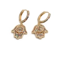 Macro view of gold-plated Hamsa hand earrings featuring colorful zirconia crystals - Large Hamsa Hand Evil Eye