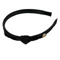 Black knotted denim headband with gold logo pendant and inner teeth for secure grip - Black