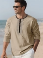Detail of khaki cotton linen henley shirt featuring a button placket and minimalist print - Khaki