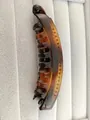 Detail view of large tortoiseshell banana clip with inner teeth on grey velvet display - Glossy Tortoiseshell