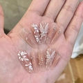 Detail of pink press-on nails featuring 3D white butterfly, rhinestones and metal chains - By1700 Graceful Eyebrows / Glue Type