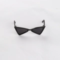 Detail view of black triangle cat eye sunglasses for small dogs and cats on white fabric - One Size-8.5cm / Black