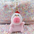 Pink capybara plush keychain wearing white rooster hat with golden metal clasp - Chick Hat Pink + Gold Clip
